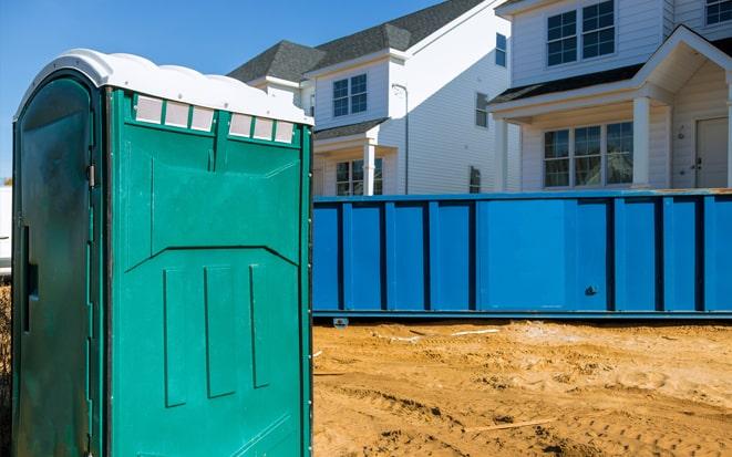 dumpster and portable toilet at a construction site in Gilroy CA